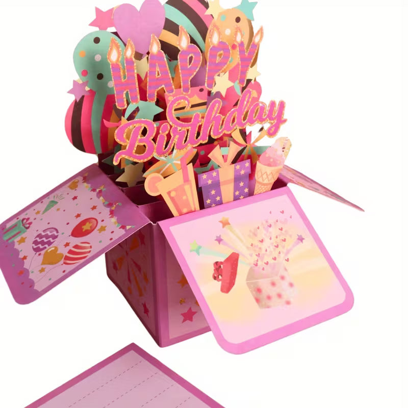 Lézerrel vágott 3D pop-up születésnapi kártya közeli felvételen — Happy Birthday felirat, színes lufik, csillagok, ajándékdobozok
