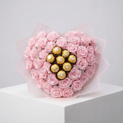 Rózsaszín csillagrózsa szív kompozíció 7 db Ferrero Rocher desszerttel a közepén