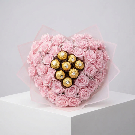 Rózsaszín csillagrózsa szív kompozíció 7 db Ferrero Rocher desszerttel a közepén